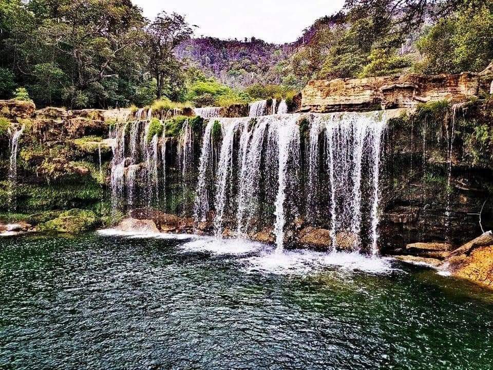 Oliha waterfall and turquoise pool